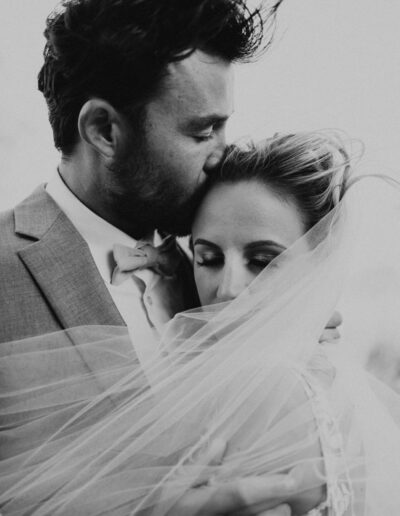 Romantic Veil Shot of a Bride and Groom by McKenzie Shea